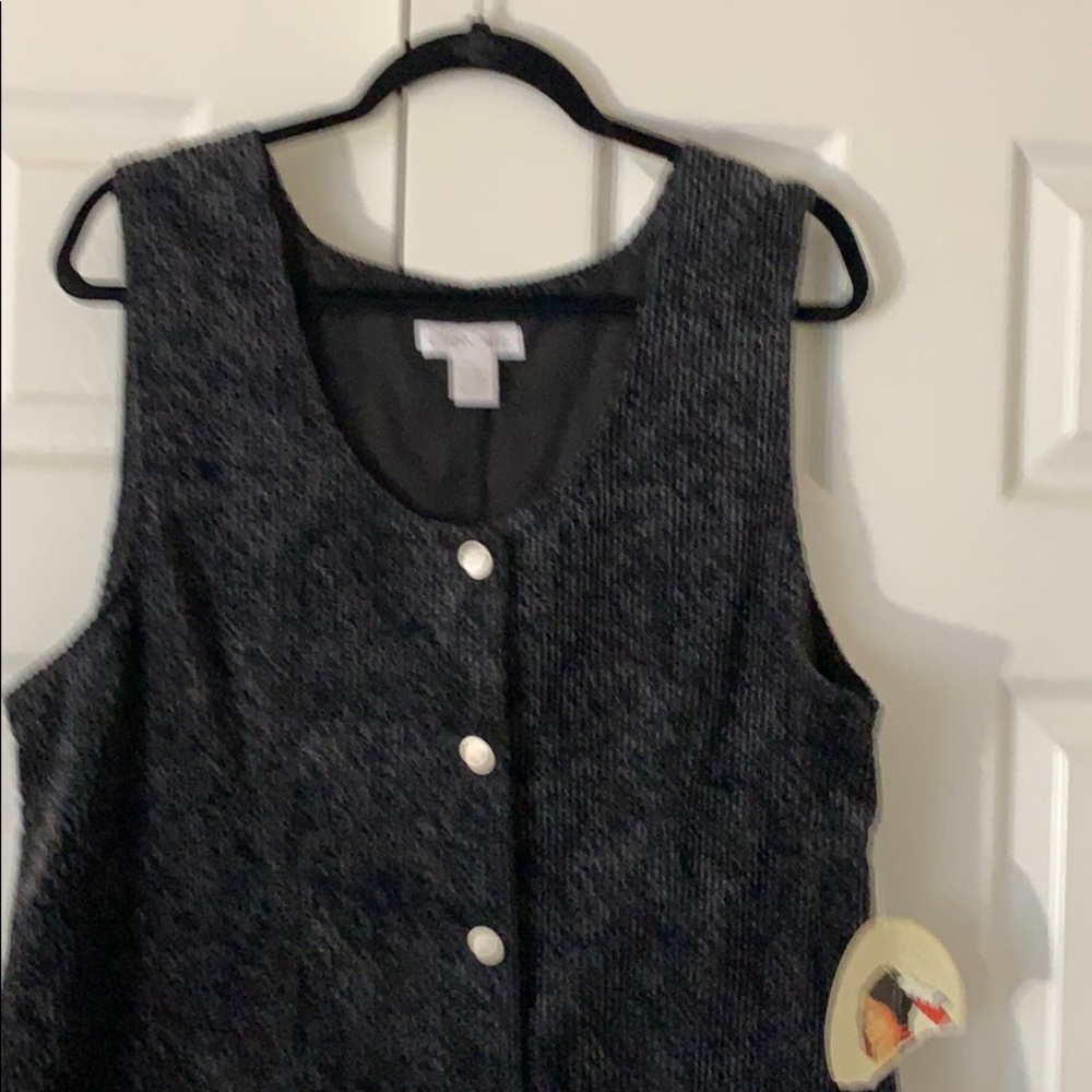 Charcoal gray sleeveless jacket.